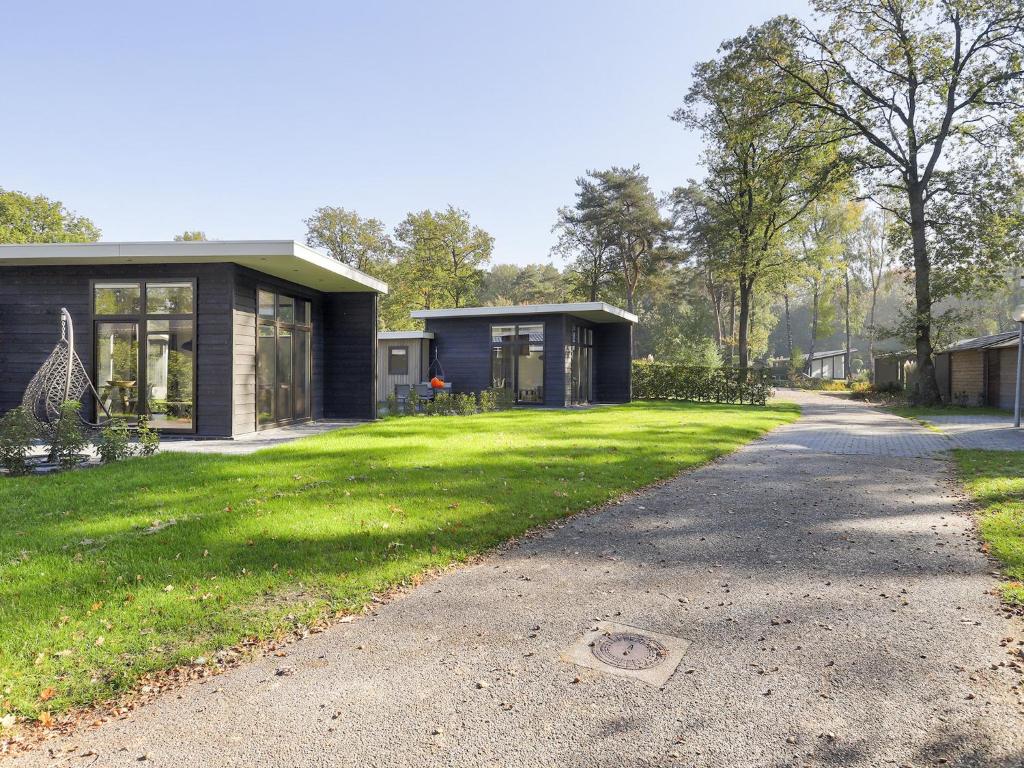 Modern wellness chalet with a smart TV, next to the forest